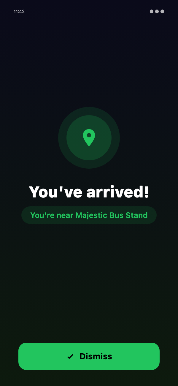 Raksha Arrival Alarm full-screen alert reading 'You've arrived! You're near Majestic Bus Stand'